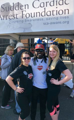 Rescuers Samantha Balaj, left, and Samantha Dyer, right, with survivor Frantzi Schaub